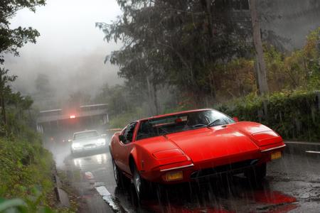 analog gloomy photo of a red Pantera car,  <lora:p4nt3r4:1>, tinted glass, driving through the jungle (at night), ((heavy rain)), ((nighttime)), helicopter chase, High Detail, Sharp focus, (photorealism), realistic, best quality, 8k, award winning, dramatic lighting, epic, cinematic, masterpiece, rim light, ambient fog:1.2, summertime, heat distortion, black birds, epic, dutch angle, wide angle lens,