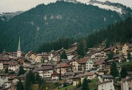 (Bokeh:1.1), kodak photo 38 mm, breath-taking film photography, movie effects, film grain, epic, masterpiece, best of the best, 4k uhd, intricate details, muted colors, wide shot of the most beautiful Swiss town in winter, snowy, pines, mountains, houses, minimalistic, aesthetic, shallow depth of image, crisp, clear, haze lighting, muted colors