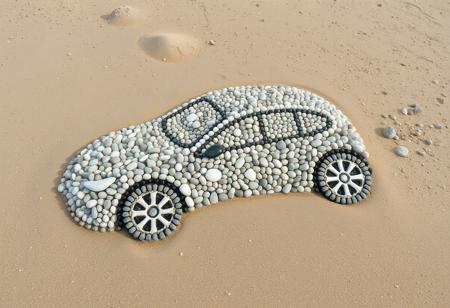 Pebble art mode, a car made from intricate pebble patterns depicted on the sandy beach