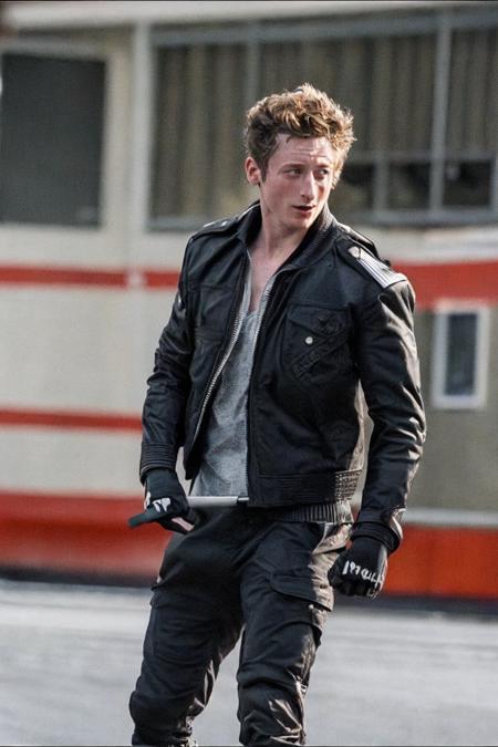 A photo of jeremywhite as an action hero wearing a ripped leather jacket, dynamic pose, actionhelper