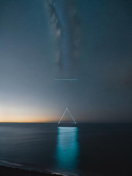 <lora:ReubenWu:1>a light triangle above the ocean at night