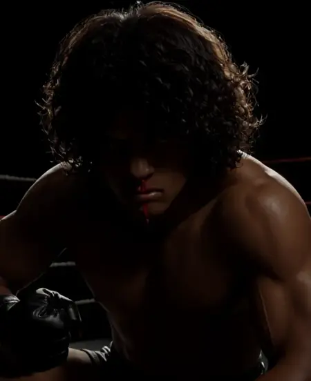 Generate a dramatic, ominous scene of a crouching male boxer in the center of a dimly lit boxing ring. His muscular form glistens with sweat under a single harsh spotlight, casting deep shadows across his body and the ring ropes behind him. Blood drips from his nose, running in a thin, vivid line that contrasts against the darkness. His gaze is intense and predatory, fixed forward with an expression that mixes raw determination and restrained rage. The dim, smoky atmosphere creates a sense of foreboding, with faint echoes of an unseen crowd reverberating in the background, heightening the tension. The camera focuses on his crouched form, capturing the quiet, simmering energy before the storm, while the shadows around the ring seem to close in, amplifying the suspense and isolation of the moment.The overall ambiance evokes a sense of tension and danger.