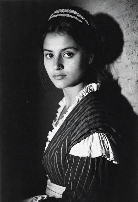 french revolution woman, face in shadow, low light, half body shot from side, 1800 costume, dark mood, ilford hp5 plus 400, medium format camera,artsy, shadows, wide angle, contact test, damaged print, faded, grainy,blurry, pixelated, motion blur, vignette, high contrast