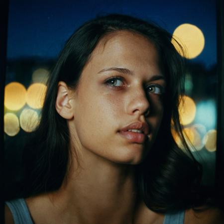 candid close-up photo of T1T0N, no makeup, looking outside the window, at night, blurred city lights, dark room, pensive expression, Shot on Kodachrome film