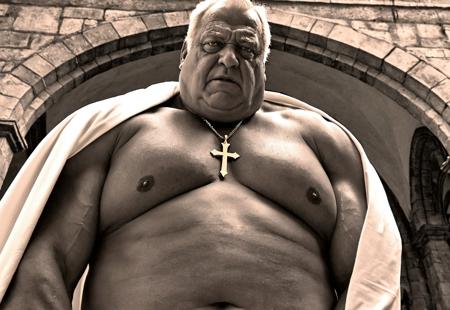Retro 90s sensual romantic grainy dark lowlight photography, dark shadows, nighttime photograph, portrait, dark church cathedral gothic cloister dungeon, solo, alone,
pov from below, sex pov, closeup,
huge big bloated saggy old man's moobs chest,

Old big bullish obese tanned grandpa, he has a double chin and thick neck, big hairy chest, muscular steroid arms, moaning lustful sensual mysterious challenging disgusted annoyed expression, blue eyes, balding light blonde hair, blonde, shiny tanned skin, large hard nipples,

wearing white robes toga, wearing black cloth wristwraps, golden necklace with holy cross,
bdsm master, torture master, dungeonmaster,
leaning forward, flexing his gigantic biceps,

father, vater, uncle, onkel, stepdad, grandpa, opa,
politician, sir, millionaire, rich, authority,

sensual sexy attractive provocative pose,

dark grainy lowlight, very dark, noise,