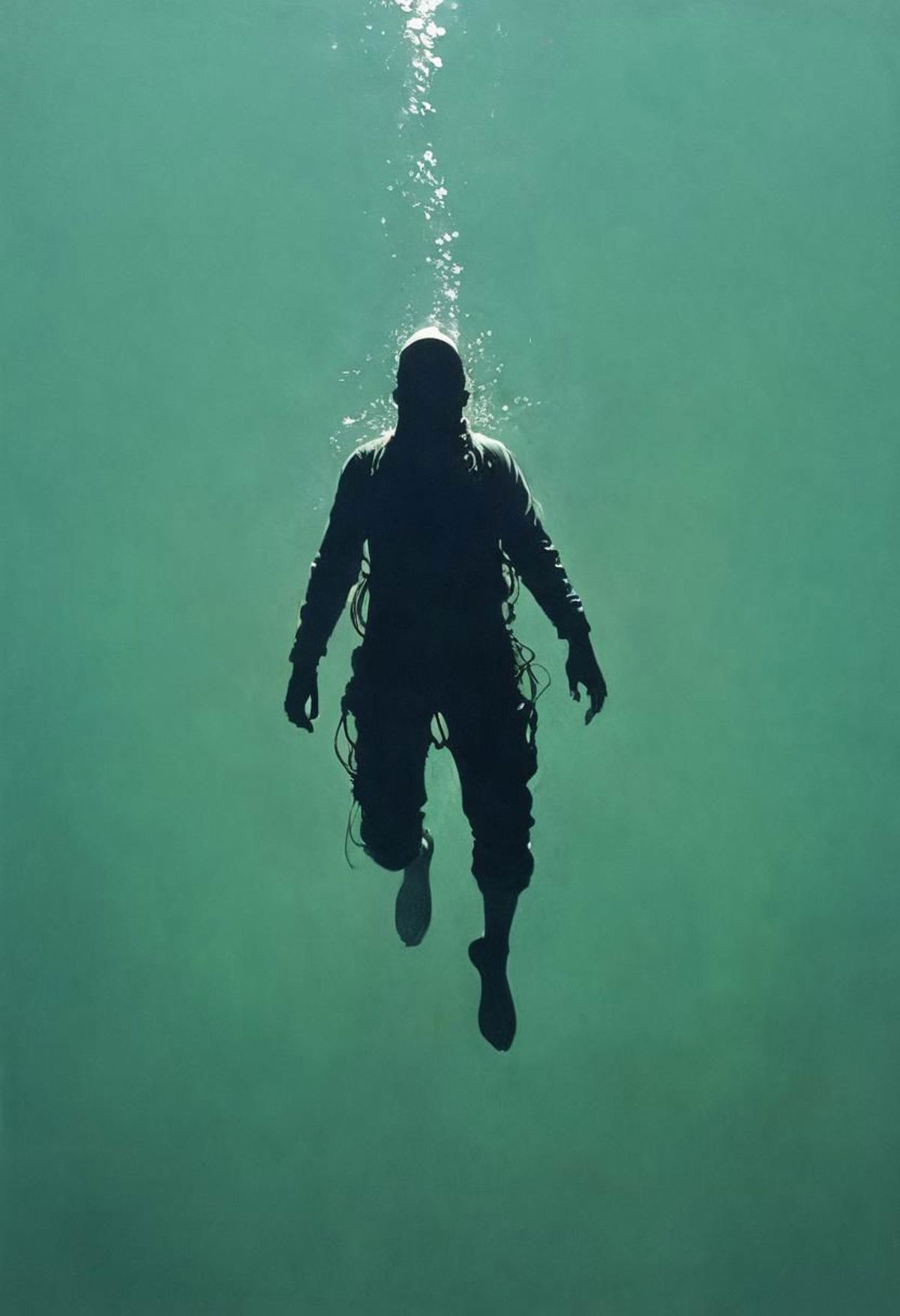 A Diver Swimming Underwater in a Black Wetsuit