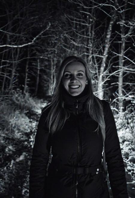 girl at night in the wood, selfie, dressed for trekking, winter, laughing, at night, very dark, infrared photography, without flash, grainy, ((motion blur)), blurry,  walking