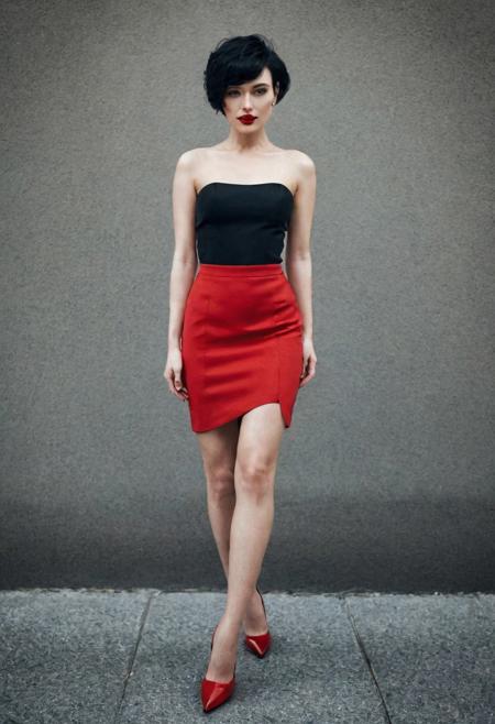 photograph by natalia drepina. woman, , (fullbody Portrait:1.3), red_manicure, red_lipstick, black hair, pixie cut, nipples exposed, hard nipples. ankles. red stilettos. epiCPhoto. intricate background. outdoor. hat