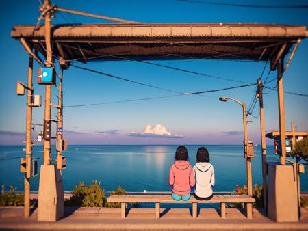 masterpiece, best quality, ultra-detailed, illustration,
shimonadaeki, outdoors, sitting, sky, scenery, ocean, from behind, 2girls, horizon, power lines, multiple girls, black hair, holding hands, short hair, cloud, 1boy, hood, blue sky, pants, sunset, utility pole, facing away, train station
 <lora:shimonadaeki:1>