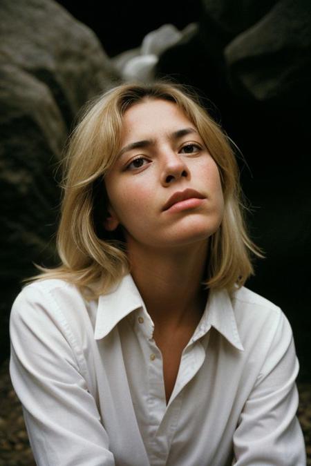 photograph of a woman, (troubled facial expression:1.1), textured skin, goosebumps, (blonde hair:1.2), (unbuttoned white shirt:1.2), distressed boyfriend jeans, long sleeves, (candlelight,chiaroscuro:1.1), cowboy shot, dark and mysterious cave with unique rock formations and hidden wonders, perfect eyes, Porta 160 color, shot on ARRI ALEXA 65, bokeh, sharp focus on subject, shot by Don McCullin