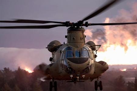 analog gloomy aerial photo of a (Chinook helicopter, <lora:ch1n00k:1>), ((nighttime)), (flying low through a city on fire), (explosions in the background), (tracer gunfire),  High Detail, Sharp focus, (photorealism), realistic, best quality, 8k, award winning, dramatic lighting, epic, cinematic, masterpiece, rim light, (action movie), war,  depth of field, dutch angle, motion blur,