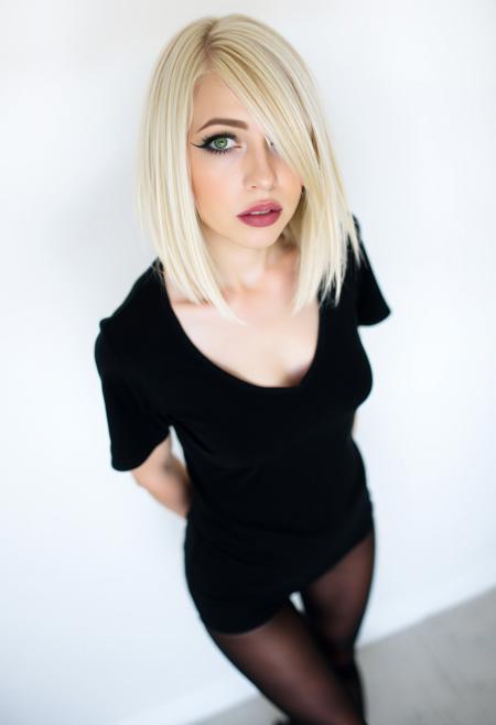 woman, blonde bobcut hair, parted half hair, green and blue eyes, eyeliner, gothic, wearing black t-shirt and black hotpants, black pantyhose, slender body, long legs, standing,