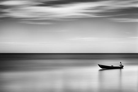 NurLens photography, Grayscale photography of a lone boat on a calm sea, low exposure, detailed, smooth, dark, best quality, trending on ArtStation, digital illustration, 3/2, ((best quality)),((masterpiece)),((detailed)) 