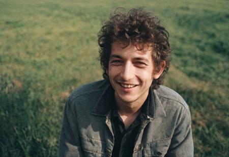 leica m6, Kodak's T400CN, color photo of young Bob Dylan, smiling, high resolution, high contrast, natural  sunlight