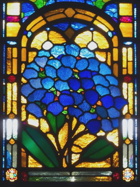 <lyco:LouisComfortTiffany:1.0> A stained glass window with a hydrangea design, the stained glass window is Square shaped with a vibrant stained glass boarder around the edges and with sunlight shining through, church style,