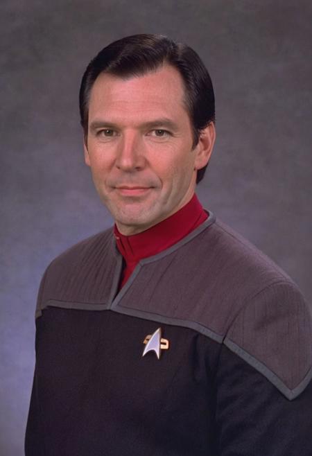 photo of a 38yo ((white man)), black hair, (black and grey ds9st uniform), red collar, long sleeves, medium hair, 
<lora:DS9XLVGRAD3:0.8>