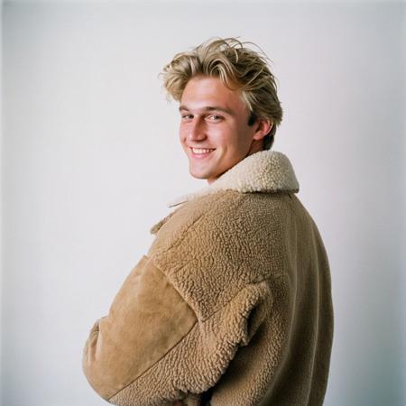 film photography style a young, dirty blonde man with a tan sheep jacket and back shirt smiling in front of a white background <lora:FILM_PHOTOGRAPHY_STYLE-000017:1>