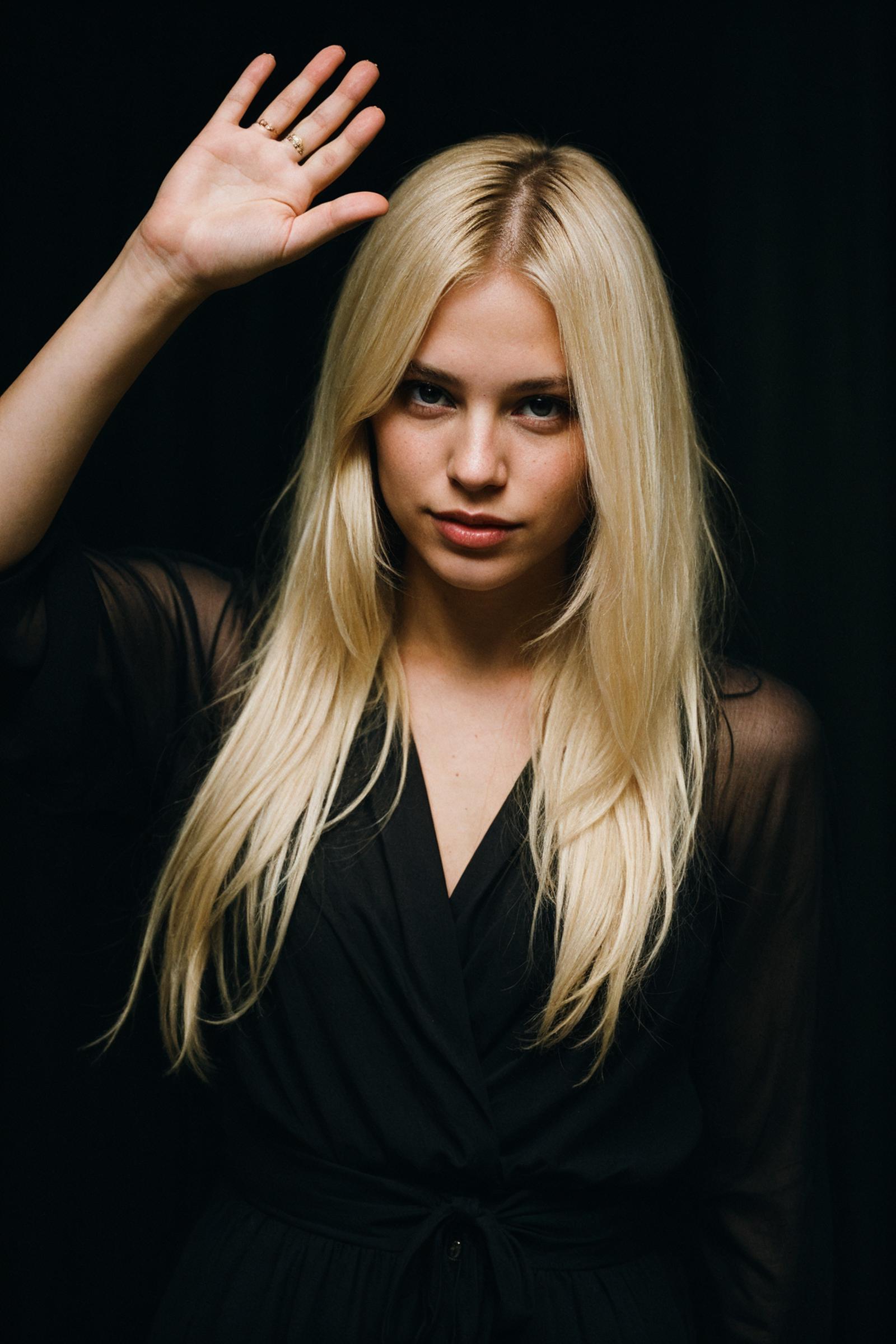 Blonde Woman with Long Hair and a Black Shirt.
