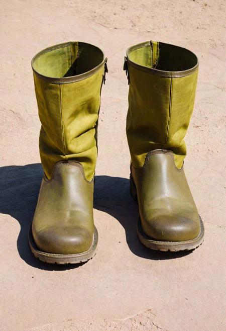 A plain, everyday visual of a minimalist, large, brutish ogre wearing dull, matte, oversized boots made of plain fabric, with simple designs, on a mundane, earthy, narrow path. Basic, flat art, practical design, wide shot, simplistic, lacking color depth, understated, direct overhead lighting, monochromatic background, with minimal details, plain colors, matching colors, shallow color, realism, traditionalism, low resolution, clear focus, mundane, colorless, simplistic, elemental, rugged, inelegant, basic, earthly, unremarkable, water-like, minimalist, hologram-free, ogrecore, industrial