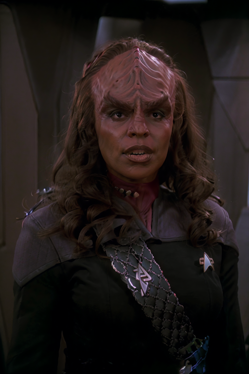 00105-headshot_of_a_klingon_woman,_forehead_ridge,_thick_eyebrows,_dark_skin,_wearing_black_and_red_ds9st_uniform,__(red_collar_1.1),_-1635187305.png