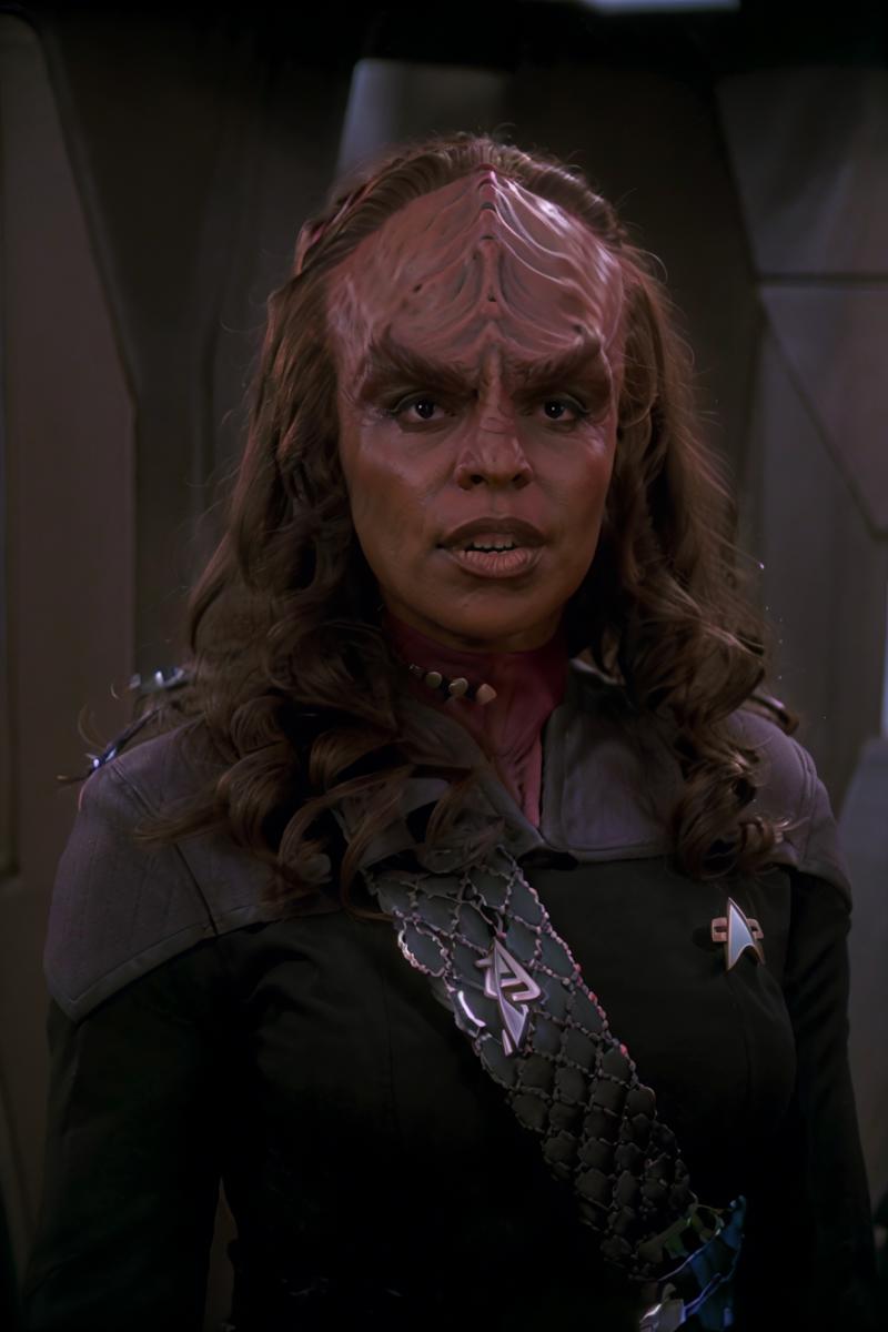 00105-headshot_of_a_klingon_woman,_forehead_ridge,_thick_eyebrows,_dark_skin,_wearing_black_and_red_ds9st_uniform,__(red_collar_1.1),_-1635187305.png