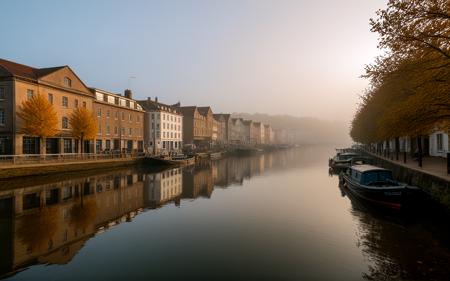wide shot,A foggy autumn morning at Bristolâs Harbourside, muted colors reflecting on still waters, historic warehouses lining the waterfront, soft golden leaves drifting in the breeze, creating a serene and atmospheric scene that captures the essence of Bristol's maritime heritage,, sweeping landscapes, unique perspectives, epic scale, revealing hidden beauty, showcasing vastness, immersive experience, precise compositions, expert piloting, dynamic angles, cinematic storytelling, showcasing natural wonders, aerial exploration