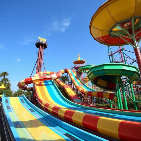 amusement park, giant slides, colorful,