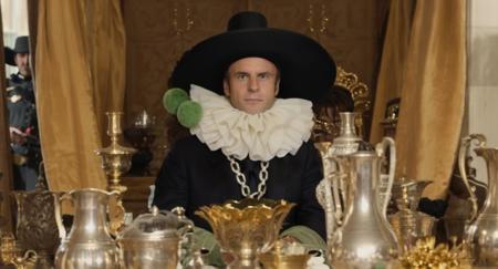 Macron768, a man in a black hat with green furballs and a table with silver cups and silver pitchers and a gold vase and a gold vase <lora:Macron768:0.6>