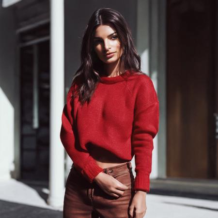 cinematic photo RAWphoto \(medium\), (emrata woman:1) \(subject\), in a (red crop sweater and jeans) \(clothing\), (simple background, portrait) \(style\), (highres, best quality, full sharp, 4 k photography) \(quality\) <lora:emrata_v2:1.0> . 35mm photograph, film, bokeh, professional, 4k, highly detailed