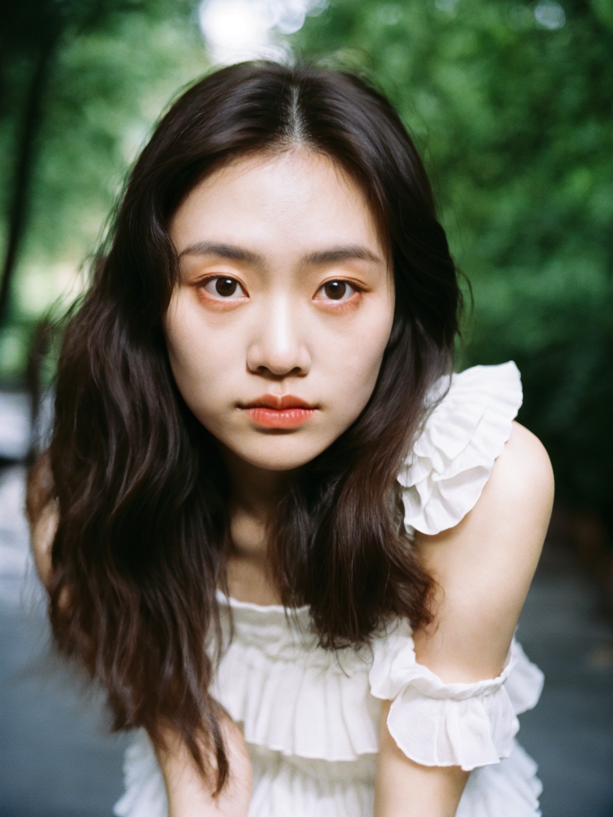film grain analog photography,captured vertical frame, young asian woman gazes upwards look curiosity, large eyes lively p...