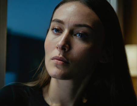davidfincherstyle, the woman is wearing a black shirt and has long hair. The environment is a room with a window. The shot is a close-up of the woman's face. It is nighttime. The image has a warm color temperature.