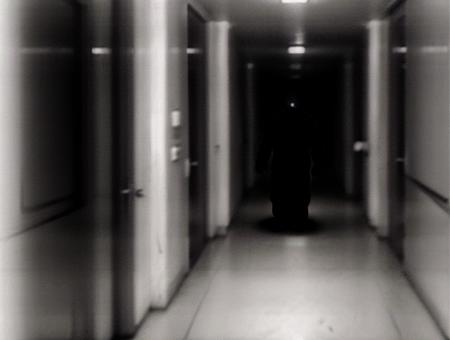 horror, grain, a blurry dark creepy monster walking down a dark hallway, fade, (out of the dark:1.3), flashlight, (shot on a smartphone:1.3), white outline, standing in an alleyway, creepy, night, lowkey, dimmed, laughing man, a creature 5 meters tall, three - point perspective, super realistic photo, soft blur lighting, sewers,  <lora:deathia_yiu_v10:0.8>