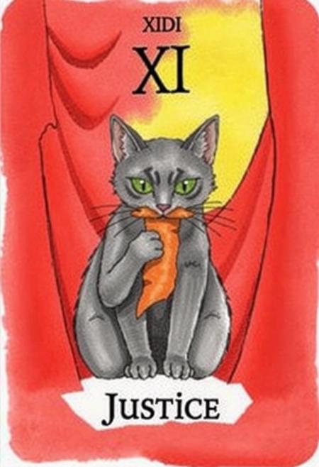 This image depicts a tarot card, specifically the "Justice" card, as indicated by the text at the bottom. The central figure is a gray feline with striking green eyes, holding an orange, somewhat limb-like object firmly in its mouth. The cat's expression appears intense and focused. Behind the feline, a dramatic swathe of deep red drapery forms the background, creating a sense of depth and perhaps solemnity. Above the cat and the drapery, a strip of light yellow is visible, suggesting a sky or a source of light. At the very top of the card, the Roman numeral 'XI' is prominently displayed, signifying its traditional number within the Major Arcana. The artwork has a distinct hand-painted or watercolor feel, with visible brushstrokes and a somewhat stylized, illustrative quality. The overall composition is simple yet impactful, drawing the viewer's eye to the central figure and its action, set against the rich red backdrop.