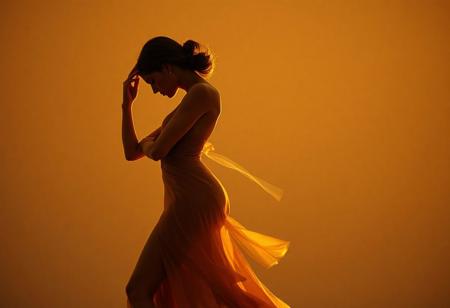A contemporary dance photograph capturing a figure in motion with a curvaceous silhouette, styled in avant-garde haute couture. The pose features a graceful bend, emphasizing organic form against a minimalist backdrop. Shot with an 85mm f/1.4 lens, using shallow depth of field and golden-hour hues for warmth. Inspired by Helmut Newton's chiaroscuro and Art Deco geometry, rendered as a 4K hyperrealistic digital painting. Subtle motion blur adds dynamism, while soft-focus textures and metallic accents introduce futurism. Context: editorial fashion spread for Vogue Italia, 2023.