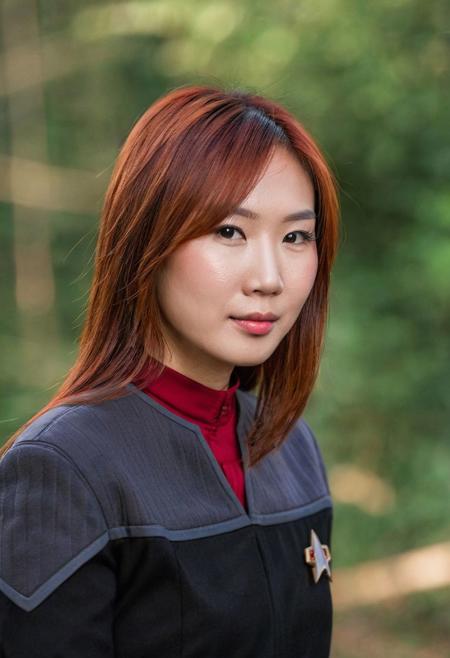 photo portrait of a 28yo ((Asian woman)), ginger hair, messy, beautiful, (black and grey ds9st uniform), red collar, long sleeves, medium hair,
<lora:DS9XLVGRAD3:0.8>