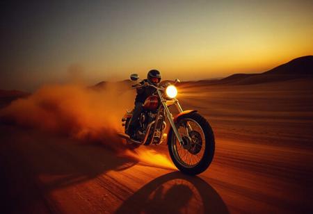 avant-garde, retro futurism , gold and chrome, california mojave high desert, noon, 1990s, robert T, techno style , motorcycle, crashing into dust trail
