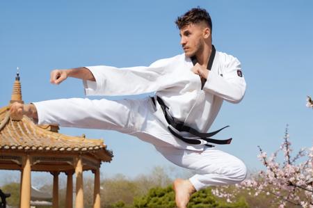 jusiki, side view, Loïc Barcourt a young man doing a jump sidekick in front of a pagoda. the man wears white karate uniform, black belt, [cherry blossom:0.25], detailed hands, toes, feet,
<lora:Rythmind_Loïc Barcourt_v4Final_hash:1> <lora:JumpedSideKick.0.9:1:lbw=0.18,0.5,0.5,0,0.8,1,1,1.1,1,1,0,0>, natural lighting, 4k, high quality, Fujifilm XT3