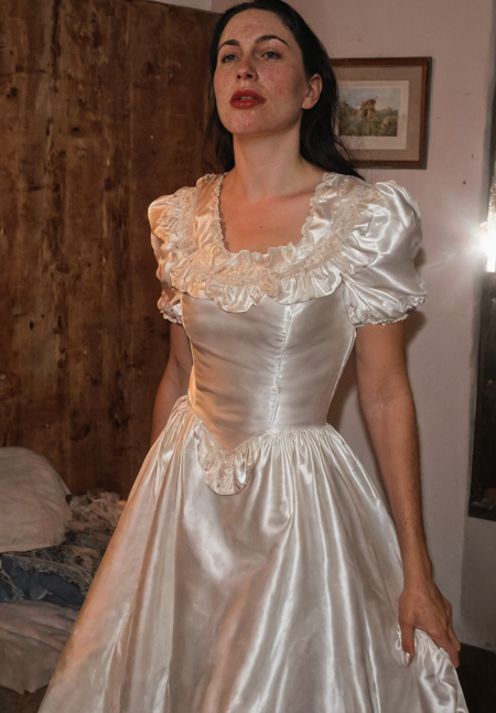Michaela is a thick white woman, Michaela has white skin, big lips, Michaela wears satin wedding dress  from ebay, satin nightgown, close-up photo of Michaela stands three-quarter side view, thick arm, full detailed face, oblong face, fake cheeks, sweating face with coily black hair, morning crust, Wrinkled loose skin with pores, Velvety, skin moles, Mature skin, lipstick, RAW photo with a dark photo,high contrast photo, high detailed photo, 4K, texture, Camera RAW, direct light night, mid-night. seductive, atmosphere. detailed background and sharp and detailed, film grain. masterpiece, best quality, amazing quality, newest, highres, high resolution, ultra-detailed, high contrast, cowboy shot, dynamic pose, Detailed natural skin and blemishes without-makeup,