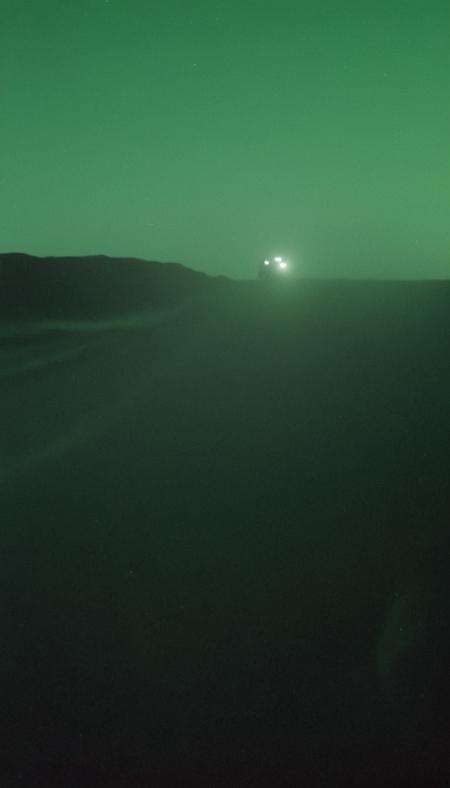 a very blurry, grainy and low resolution night vision scene with a dark green hue, close up angle old digital camera style, military vehicles, intense motion blur, old analog photo, long exposure, glowing night vision, depicting a shadowy figures of soldiers in full tactical gear are running. motion blur. In the desert. Night time with a starry dark sky. The entire scene should have a blurry, grainy, low-resolution appearance of degraded night vision footage, with indistinct details and a motion blur to enhance the feeling of covert operations in a tense, secretive atmosphere. motion blur, film grain, low res, digital noise, night vision style, motion blur, helicopters, long exposure, low light   <lora:- SDXL - vanta-black_contrast_V3.0:0.5>    <lora:soaked_rum:0.8>