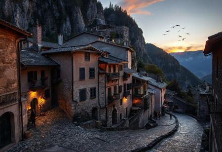 professional photo, photo of an old European mountain village with medieval cobblestone streets, a few people dot the streets but are too far to make out any details, a small flock of birds fly in the distances, no cars on the streets, at twilight, sun glows just over the horizon