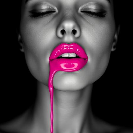 A close-up, monochromatic portrait of a woman's face, with her eyes gently closed, exuding an aura of calm and allure. Her skin is rendered in smooth grayscale, creating a striking contrast against her glossy, vividly colored lips painted in a bright, dripping fuchsia pink. The lips appear wet and lustrous, with a thick drip of the vibrant color flowing down her chin, evoking a sense of surreal elegance and mystery. The black background adds a sense of depth and isolation, enhancing the focus on her facial features and the dramatic color of her lips. The lighting is soft yet precise, casting subtle shadows and highlighting the contours of her face. The overall style is hyper-realistic with an artistic, high-fashion editorial vibe, emphasizing texture, contrast, and the vividness of the pink color in an otherwise grayscale composition