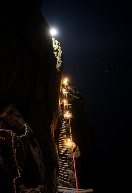 A beautifully lit and composed professional photograph of a via ferrata route