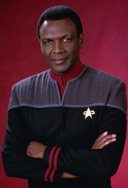 photo of a ((man)),  ((dark skin, dark-skinned man)), black hair, black and grey ds9st uniform, red collar, long sleeves, short hair, 
<lora:DS9XLVGRAD3:0.8>