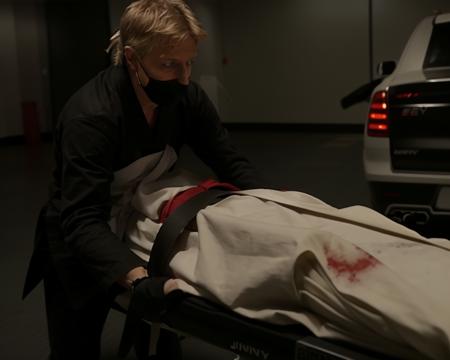 Johnnylawrence person <lora:JohnnyLawrence-Lora:.8> pushing a dead body that's in closed black body-bag on a gurney.