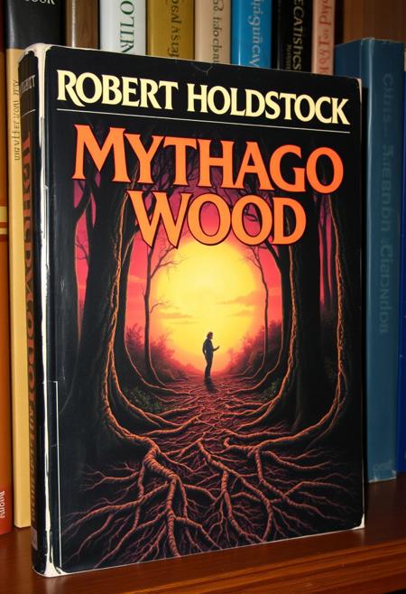 1970s Fantasy style book cover, with large bold text of "ROBERT HOLDSTOCK" along the top of the image, with the title of "Mythago Wood".
artwork in the style of Geoff Taylor to show a dark fantasy forest landscape, sunset,  with a mythical being standing at the end of a path covered in tree roots and leaves. The hardback book is sitting on a bookshelf
