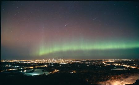 analog film photo <lora:Aurora-1:1>,aurora-1,space,aurora,night,night sky,sky,star \(sky\),starry \(sky\),shooting star,galaxy,milky way,city lights,moon,fireworks,city,planet,light particles,cityscape,cloud,snowing,skyline,skyscarper,constellation,scenery,, extremely detailed photo of a prompt . . faded film, desaturated, 35mm photo, grainy, vignette, vintage, Kodachrome, Lomography, stained, highly detailed, found footage