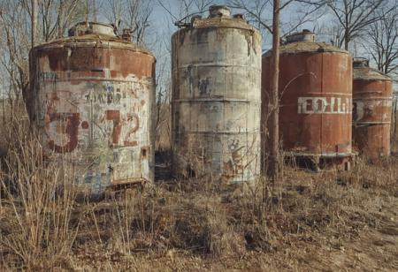 Rusty abandoned chemical tanks, large stenciled numbers on tanks, tanks are painted a faded red color with a white stripe, outdoors, abandoned Soviet chemical facility, plumbing, pipes, Stunning background,
many details, extreme detailed, full of details,
Wide range of colors., Dramatic,Dynamic,Cinematic,Sharp details
Insane quality. Insane resolution. Insane details. Masterpiece. 32k resolution.