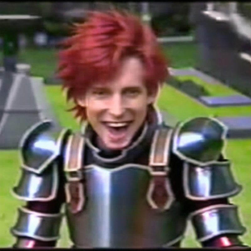 <lora:VHS3:1.0> , VHS, VHS footage of, distortion,  [glitch], armor, full armor, red hair, redhead, short hair, smile, tongue