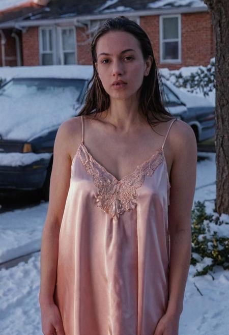A beautiful female, wearing a peach satin nightgown, in her front yard, snow, December, dusk, street photography, detailed, closeup, early 2000s, DSLR, UHD