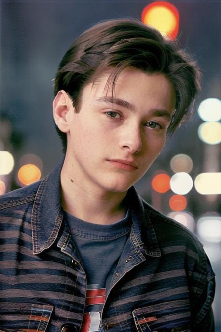 a young man, 20 years old, 19 years old, (at a payphone), black tee shirt, ((blue jean jacket)), 8k, raw, uhd, (midnight downtown), cinematic masterpiece, cinematic blue lighting, (close up:1.2) <lora:edwardFurlong:1>, perfect face, clear eyes